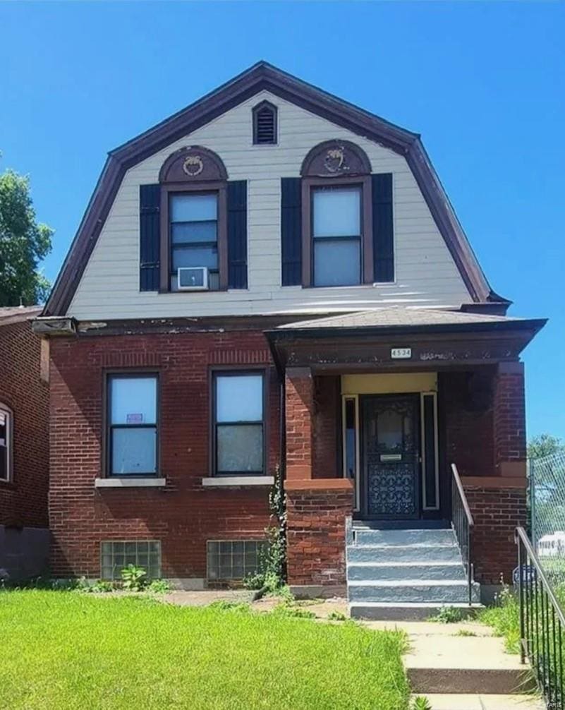 4534 Margaretta Ave, Saint Louis, MO 63115 - dutch colonial with a gambrel roof and brick siding