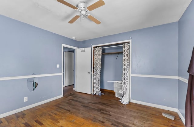 unfurnished bedroom with wood finished floors, baseboards, a closet, and ceiling fan