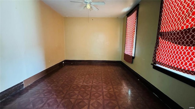 3449 Miami St, Saint Louis, MO 63118 - empty room with a ceiling fan and baseboards