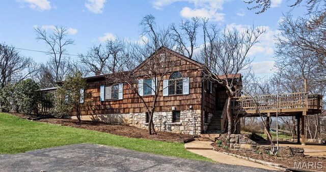2013 Lily Ave, Saint Louis, MO 63122 - view of front of house with a wooden deck, stairway, and stone siding
