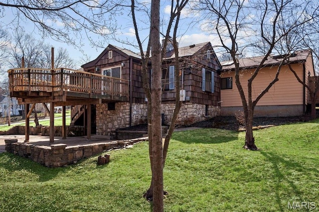 2013 Lily Ave, Saint Louis, MO 63122 - back of house featuring a wooden deck, a patio area, a yard, and stone siding