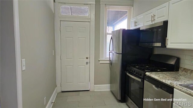 6522 Bartmer, University City, MO 63130 - kitchen with stainless steel appliances, white cabinets, backsplash, and light stone counters