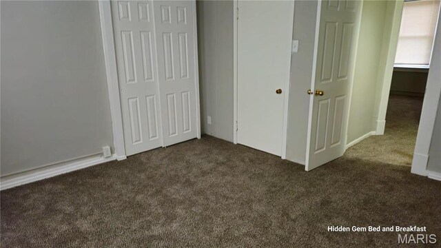 6522 Bartmer, University City, MO 63130 - unfurnished bedroom with dark colored carpet and a closet