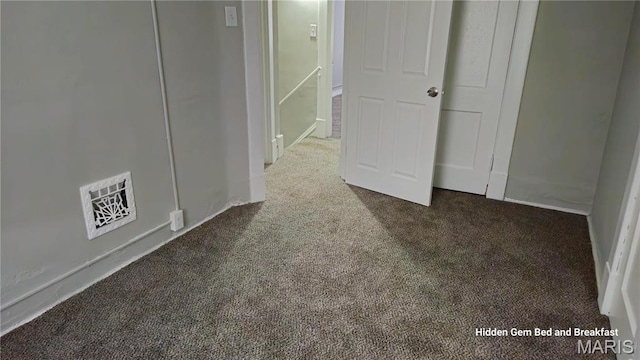 6522 Bartmer, University City, MO 63130 - unfurnished bedroom featuring dark colored carpet