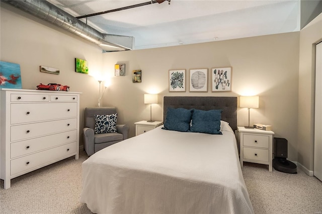 bedroom featuring light carpet
