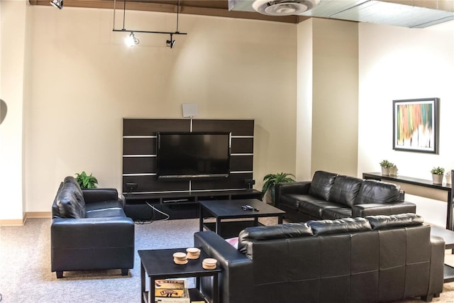 living room with carpet and baseboards