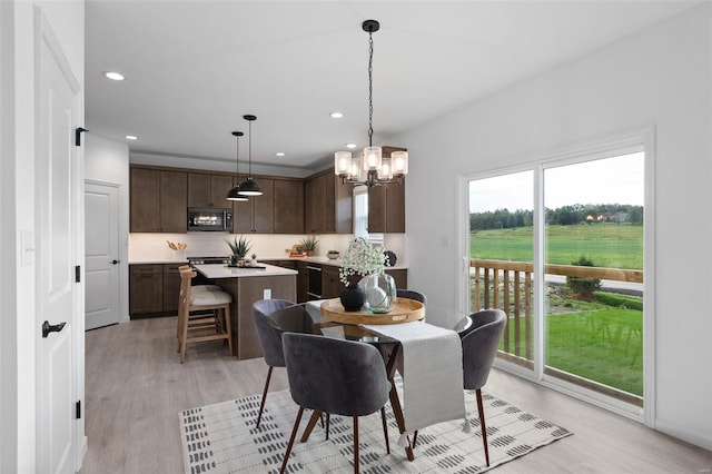 2543 Chukka Dr, Eureka, MO 63025 - dining space featuring light wood-type flooring, a chandelier, and recessed lighting