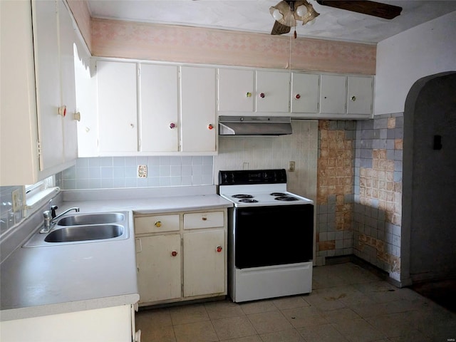 700 Pershing St E, St Louis, IL 62203 - kitchen featuring white electric stove, a sink, under cabinet range hood, a ceiling fan, and light countertops