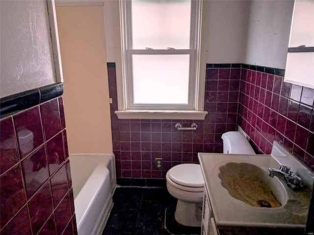 700 Pershing St E, St Louis, IL 62203 - full bath with tile walls, toilet, a bath, and vanity