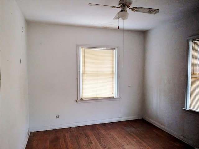 700 Pershing St E, St Louis, IL 62203 - spare room with dark wood-style floors, ceiling fan, and baseboards
