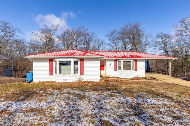 8 Crescent Dr, Viburnum, MO 65566 - ranch-style house with metal roof, an attached carport, and concrete driveway