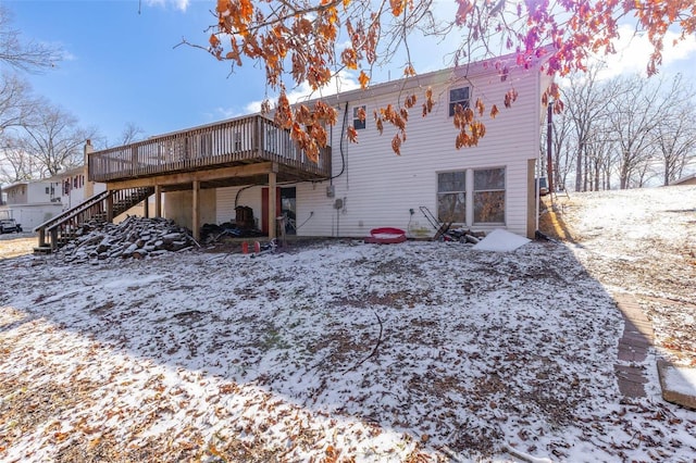 8 Crescent Dr, Viburnum, MO 65566 - snow covered back of property with a deck and stairs