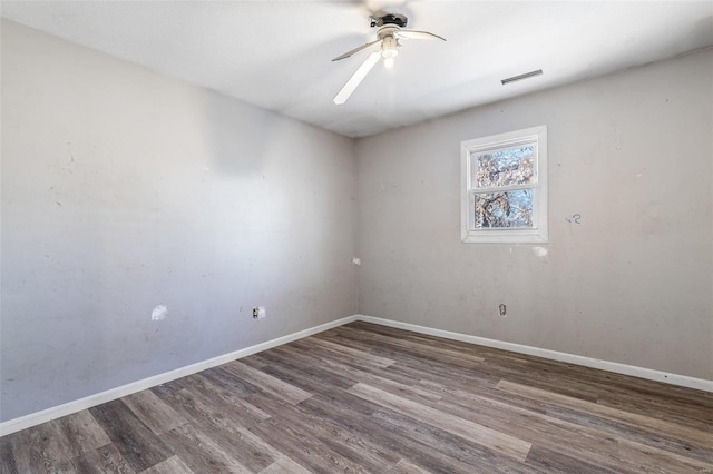 8 Crescent Dr, Viburnum, MO 65566 - spare room featuring wood finished floors, a ceiling fan, and baseboards