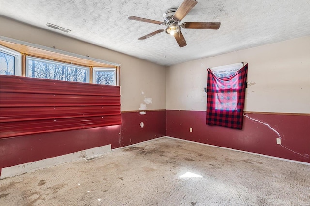 8 Crescent Dr, Viburnum, MO 65566 - carpeted spare room featuring a textured ceiling, a ceiling fan, and baseboards