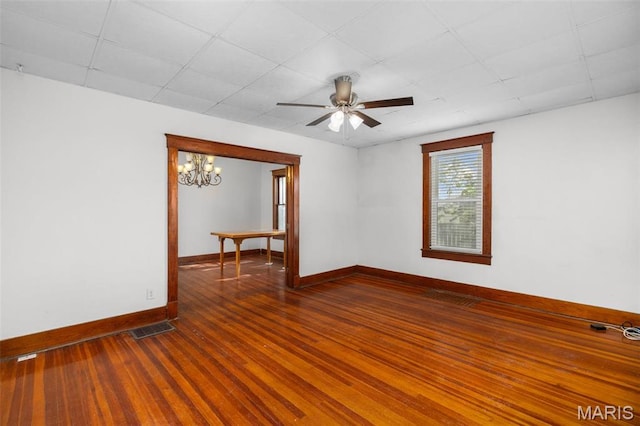 205 W 2nd St N, Wright City, MO 63390 - unfurnished room featuring a chandelier, wood finished floors, baseboards, and ceiling fan