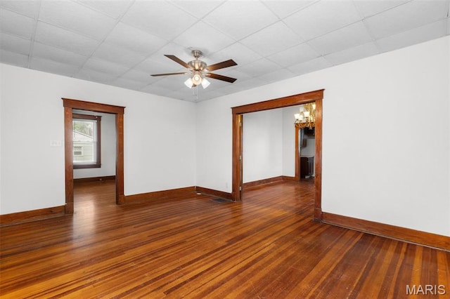 205 W 2nd St N, Wright City, MO 63390 - unfurnished room with wood-type flooring, baseboards, a drop ceiling, and a ceiling fan