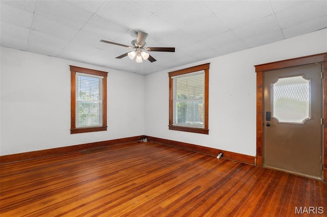 205 W 2nd St N, Wright City, MO 63390 - unfurnished room with wood-type flooring, a ceiling fan, and baseboards
