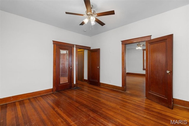 205 W 2nd St N, Wright City, MO 63390 - unfurnished bedroom featuring baseboards, wood finished floors, and ceiling fan