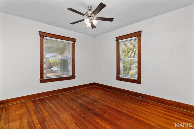 205 W 2nd St N, Wright City, MO 63390 - spare room with baseboards, dark wood-style floors, and ceiling fan
