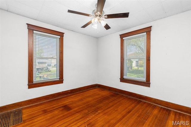 205 W 2nd St N, Wright City, MO 63390 - empty room featuring hardwood / wood-style flooring, baseboards, and a ceiling fan
