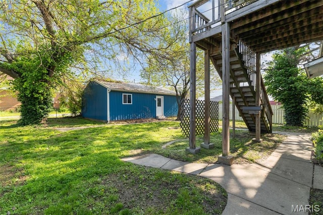 205 W 2nd St N, Wright City, MO 63390 - view of grassy yard featuring stairs, an outdoor structure, and a wooden deck