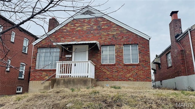 4019 Meramec St, Saint Louis, MO 63116 - view of front facade with brick siding and a chimney