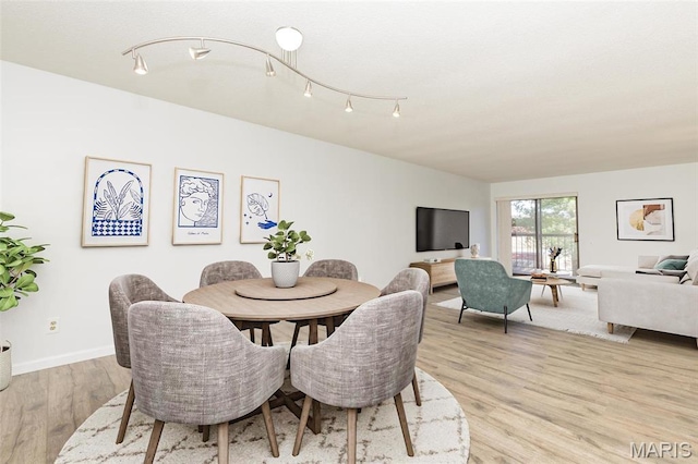 585 Coeur De Royale Dr Unit 201, Saint Louis, MO 63141 - dining area with light wood-type flooring and baseboards