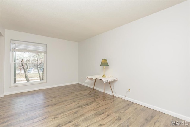585 Coeur De Royale Dr Unit 201, Saint Louis, MO 63141 - unfurnished room with wood finished floors and baseboards