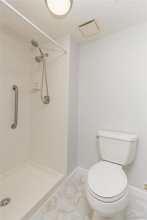 585 Coeur De Royale Dr Unit 201, Saint Louis, MO 63141 - full bathroom with marble finish flooring, baseboards, a stall shower, and toilet
