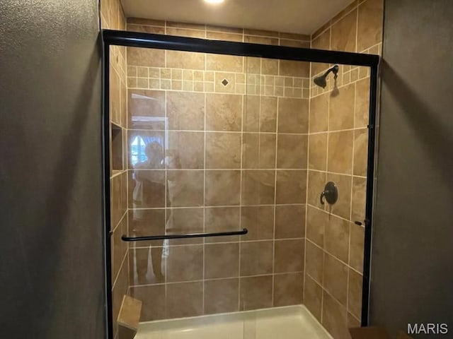 full bath featuring a stall shower