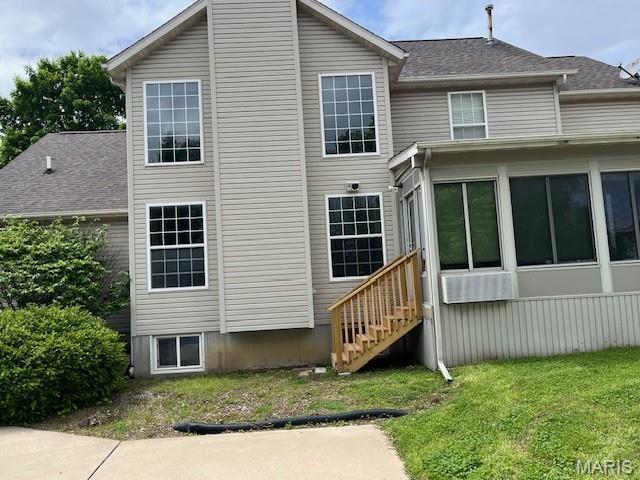 1212 Usher Dr, Ofallon, IL 62269 - back of house with a lawn and roof with shingles
