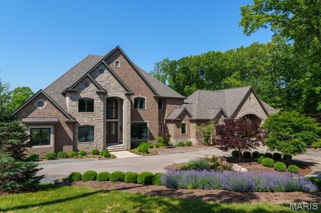 2535 S Lindbergh Blvd, Saint Louis, MO 63131 - french provincial home with stone siding and curved driveway
