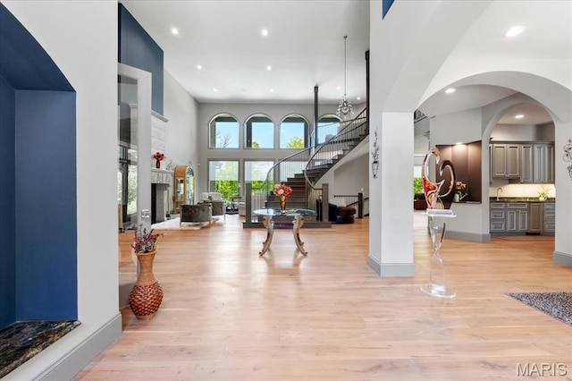 2535 S Lindbergh Blvd, Saint Louis, MO 63131 - entryway featuring light wood-style floors, recessed lighting, baseboards, arched walkways, and stairway