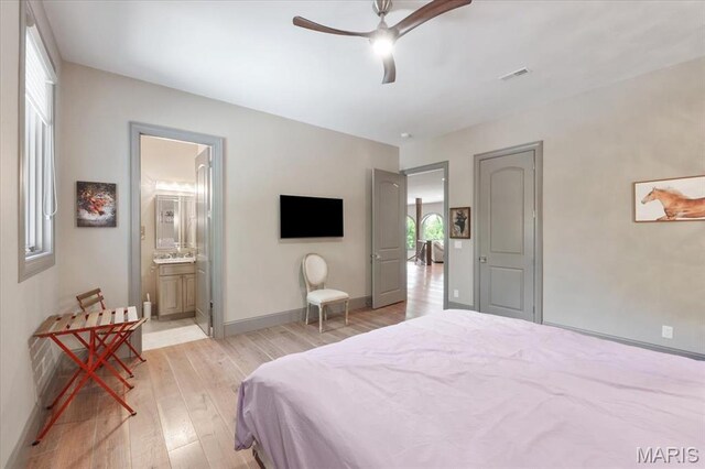 2535 S Lindbergh Blvd, Saint Louis, MO 63131 - bedroom featuring light wood-type flooring, baseboards, ceiling fan, and connected bathroom