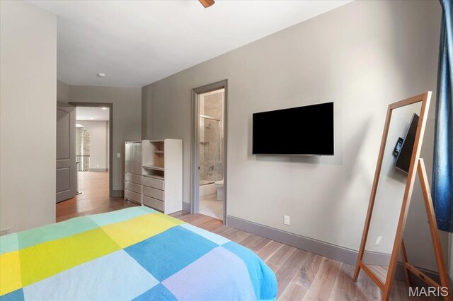 2535 S Lindbergh Blvd, Saint Louis, MO 63131 - bedroom with wood finished floors, connected bathroom, and baseboards