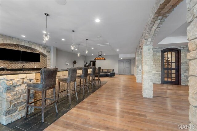 2535 S Lindbergh Blvd, Saint Louis, MO 63131 - indoor bar featuring wood finished floors, recessed lighting, and decorative light fixtures