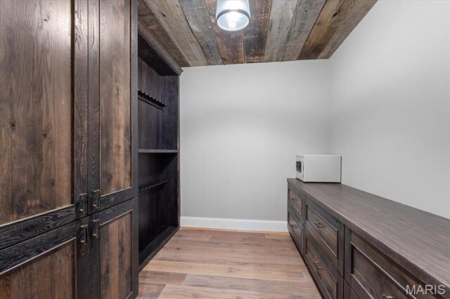 2535 S Lindbergh Blvd, Saint Louis, MO 63131 - laundry room featuring light wood-style floors and baseboards