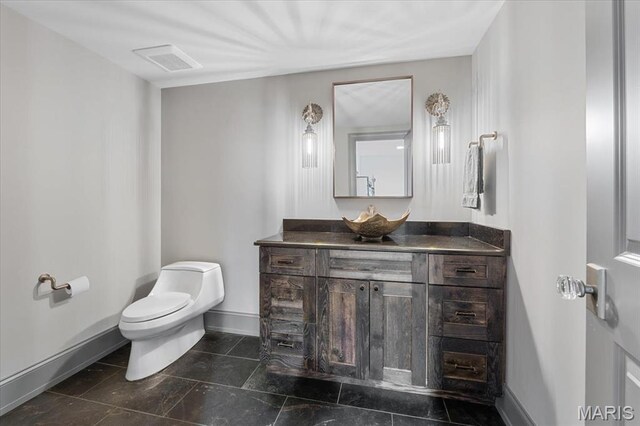 2535 S Lindbergh Blvd, Saint Louis, MO 63131 - bathroom featuring vanity, toilet, and baseboards