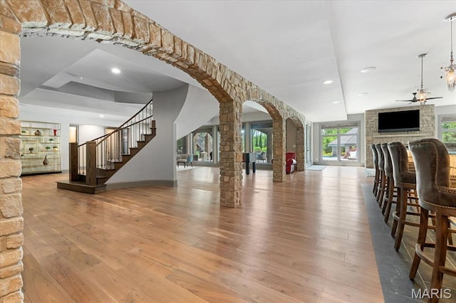 2535 S Lindbergh Blvd, Saint Louis, MO 63131 - bar with a ceiling fan, arched walkways, decorative columns, hardwood / wood-style flooring, and recessed lighting