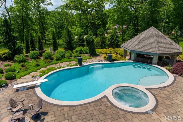 2535 S Lindbergh Blvd, Saint Louis, MO 63131 - view of pool with a gazebo, a patio area, a diving board, and a pool with connected hot tub