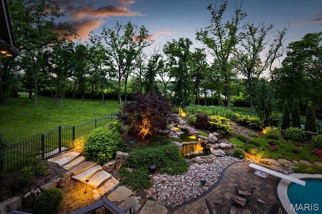2535 S Lindbergh Blvd, Saint Louis, MO 63131 - yard at dusk featuring a garden pond