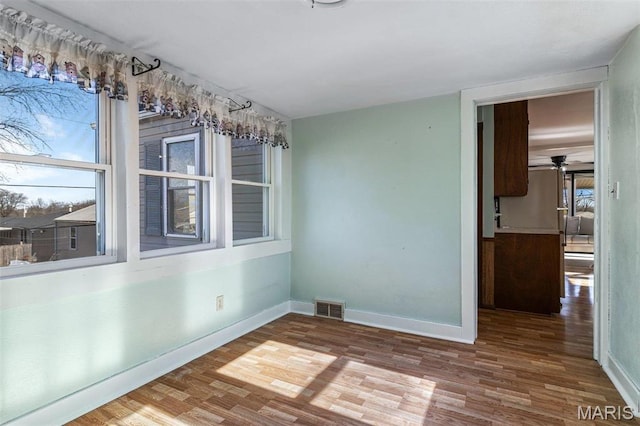 215 Virginia St, Saint Genevieve, MO 63670 - spare room with wood finished floors and baseboards