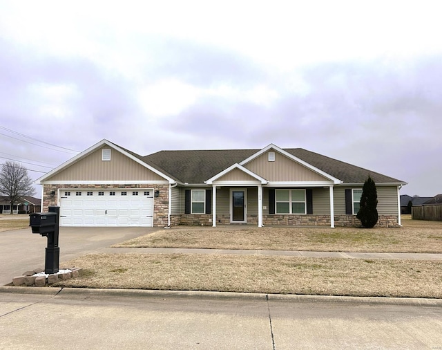 view of front of home featuring stone siding, concrete driveway, a garage, board and batten siding, and a shingled roof