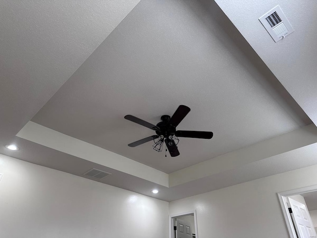 detailed view of recessed lighting and a ceiling fan