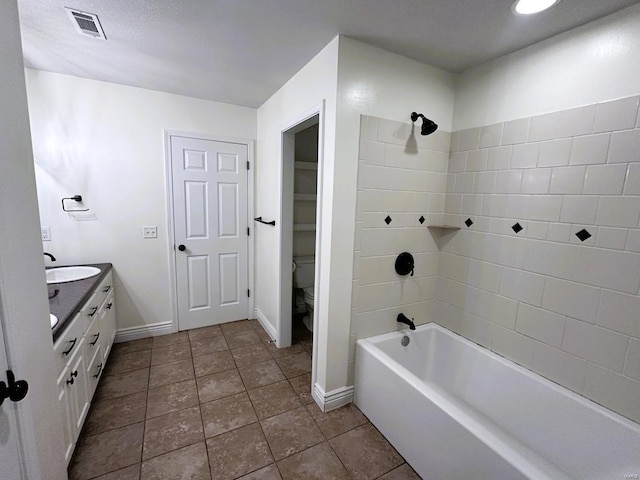 full bath featuring double vanity, baseboards, shower / washtub combination, tile patterned floors, and toilet