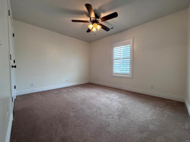 carpeted empty room with baseboards and ceiling fan