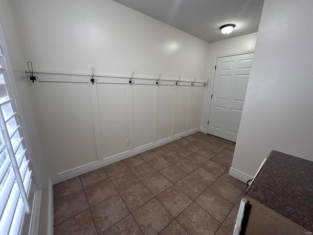 interior space featuring baseboards