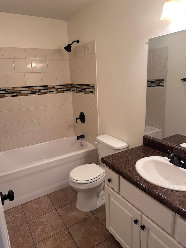 full bathroom with toilet, tile patterned flooring, vanity, and bathtub / shower combination