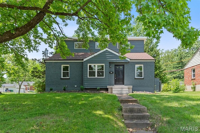 1247 Charlane Ct, Saint Louis, MO 63119 - view of front facade featuring brick siding, a front yard, and a shingled roof