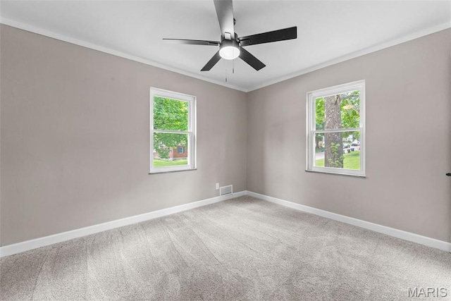 1247 Charlane Ct, Saint Louis, MO 63119 - carpeted empty room featuring healthy amount of natural light, ornamental molding, and ceiling fan